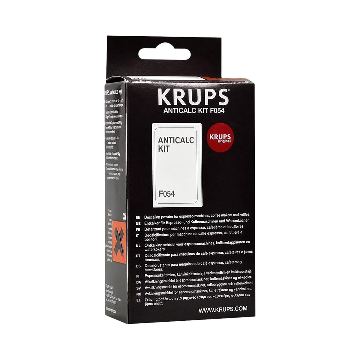 Deux sachets de détartrant Krups et un test de dureté posés sur un plan de travail en bois