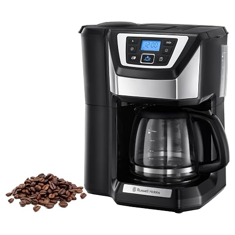 Cafetière filtre Russell Hobbs noire avec broyeur intégré, façade en acier brillant et verseuse en verre.