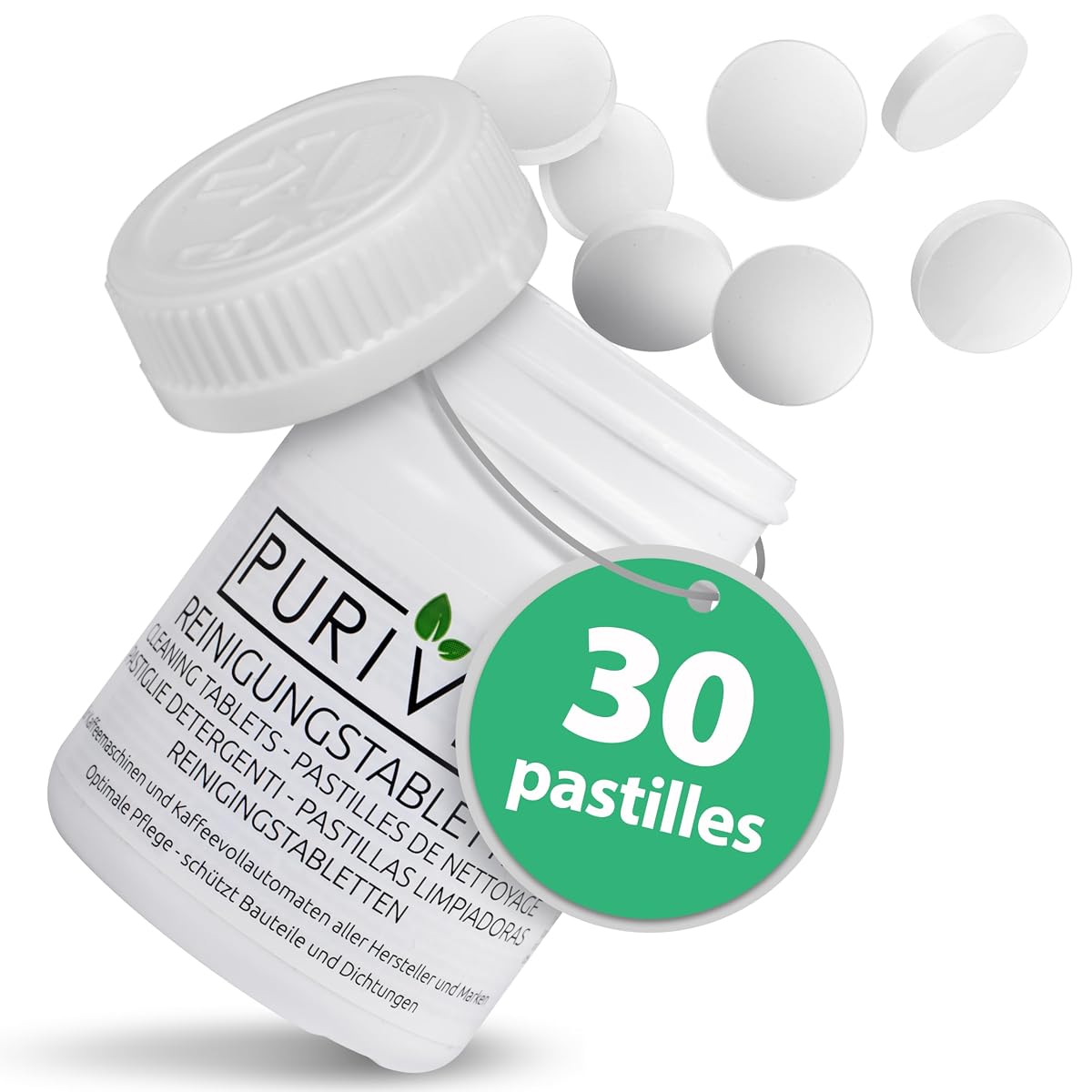 Trente pastilles blanches de nettoyage disposées devant une machine à café sur un plan de travail