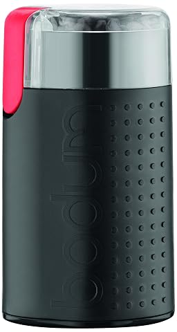 Moulin à café électrique Bodum Bistro noir avec couvercle transparent sur un plan de travail en bois